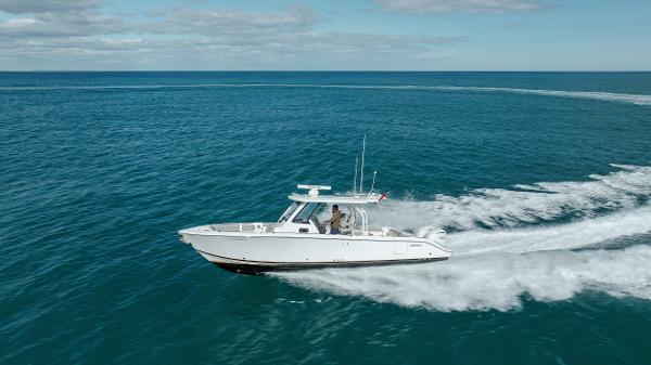 Pursuit S 328 2022 Pursuit S 328 boat cruising on open water.