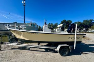 May-Craft 1800CC 2017 May-Craft 1800CC boat on trailer, labeled "Reel Love," with Suzuki outboard motor.