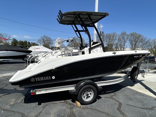 Yamaha Boats 195 FSH Sport 2021 Yamaha Boats 195 FSH Sport on trailer, black and white design, outdoor display.