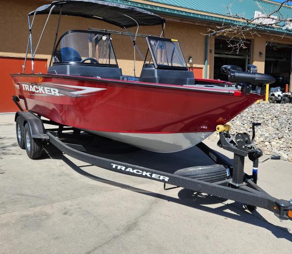 Tracker Pro Guide V-175 WT 2025 Tracker Pro Guide V-175 WT boat on trailer, red exterior, parked outdoors.