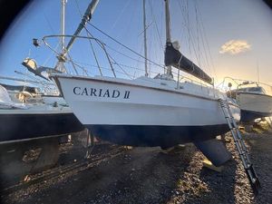 Westerly Berwick 1978 Westerly Berwick sailboat "Cariad II" on dry dock at sunset.