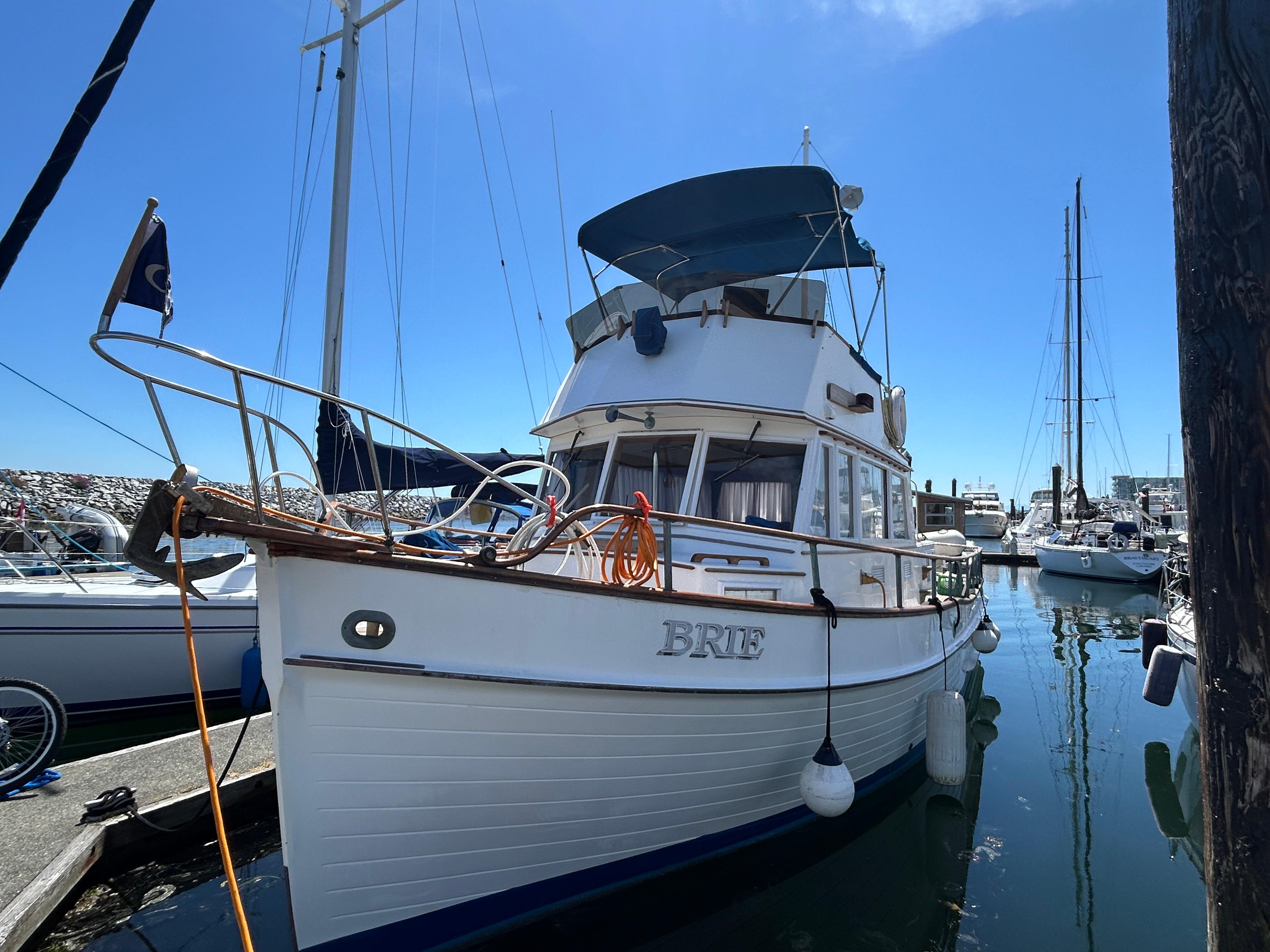 Grand Banks 36 Classic 1980 Grand Banks 36 Classic boat docked in a marina under clear blue skies.