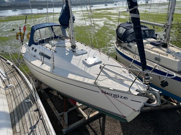 Moody 31 Sailboat Moody 31, 1999 model, docked on land, named "Energize," with blue canopy.