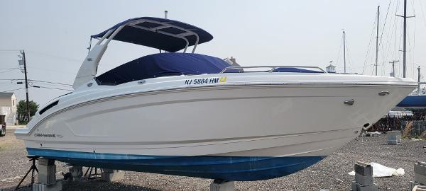 Chaparral 257 SSX 2018 Chaparral 257 SSX boat on dry dock with blue cover.