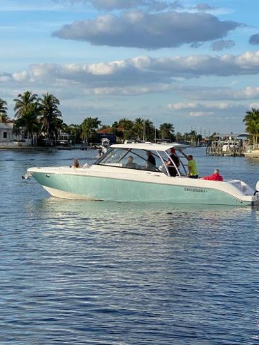 Everglades 340 DC 2019 Everglades 340 DC boat cruising on a sunny day in a coastal waterway.