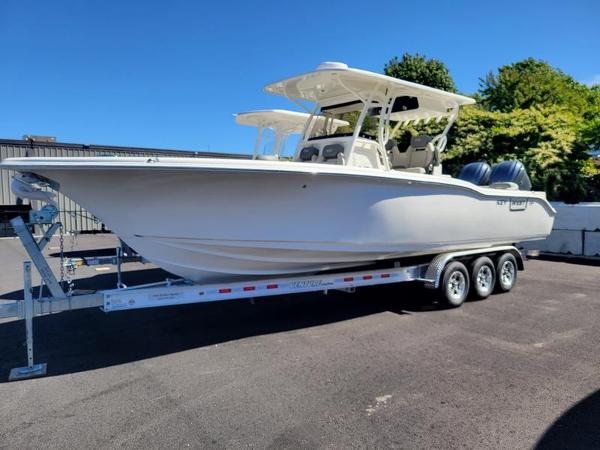 Key West 291 FS 2025 Key West 291 FS boat on trailer, parked outdoors.