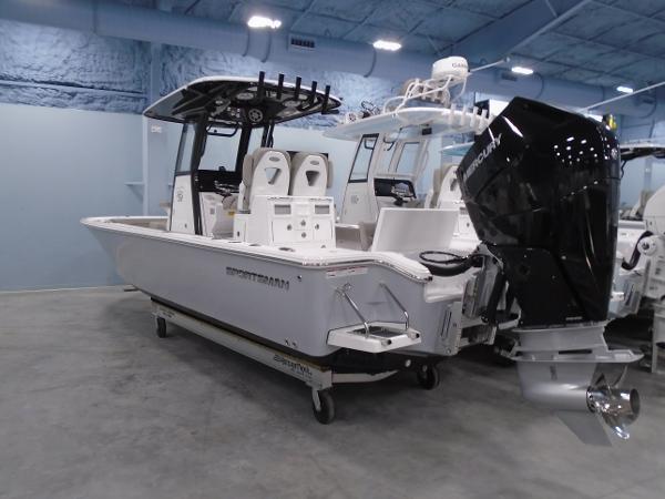 Sportsman 267OE 2024 Sportsman 267OE boat with Mercury outboard motor in showroom.