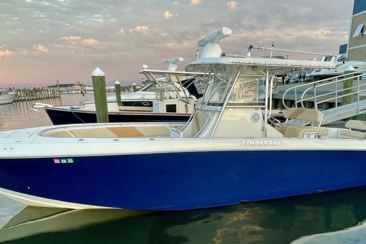 Fountain 34 Center Console 2007 Fountain 34 Center Console boat docked at marina during sunset.