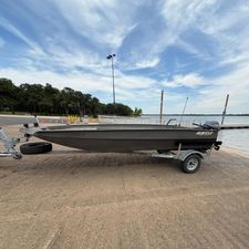 Alweld 1852 Invader 2021 Alweld 1852 Invader boat on trailer by a lakeside dock.