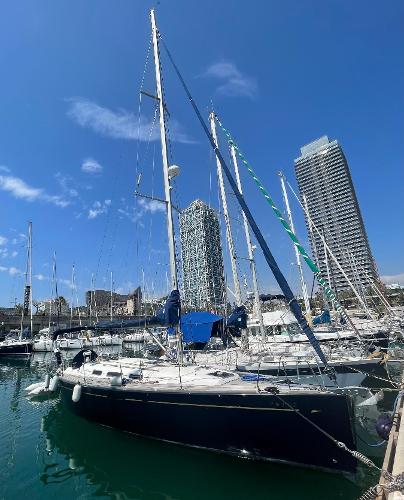 Dufour 40 Performance 2007 Dufour 40 Performance sailboat docked in a marina with city skyline.