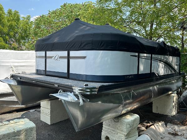 Qwest NEW NEW 816 Lanai 20HP (XF17) 2023 Qwest E 816 Lanai LT pontoon boat with black cover, parked on blocks.