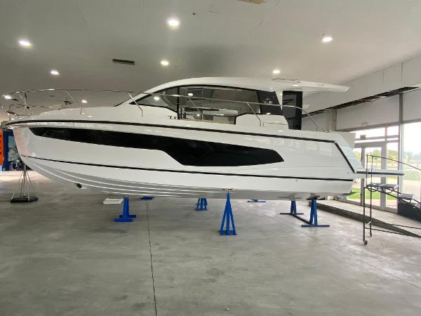Sealine C335 2025 Sealine C335 yacht displayed indoors on blue stands.