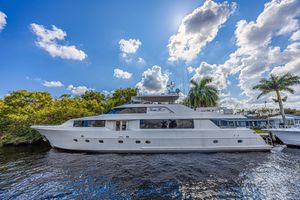 Westport 112 Luxurious 2011 Westport 112 yacht docked under a vibrant blue sky.