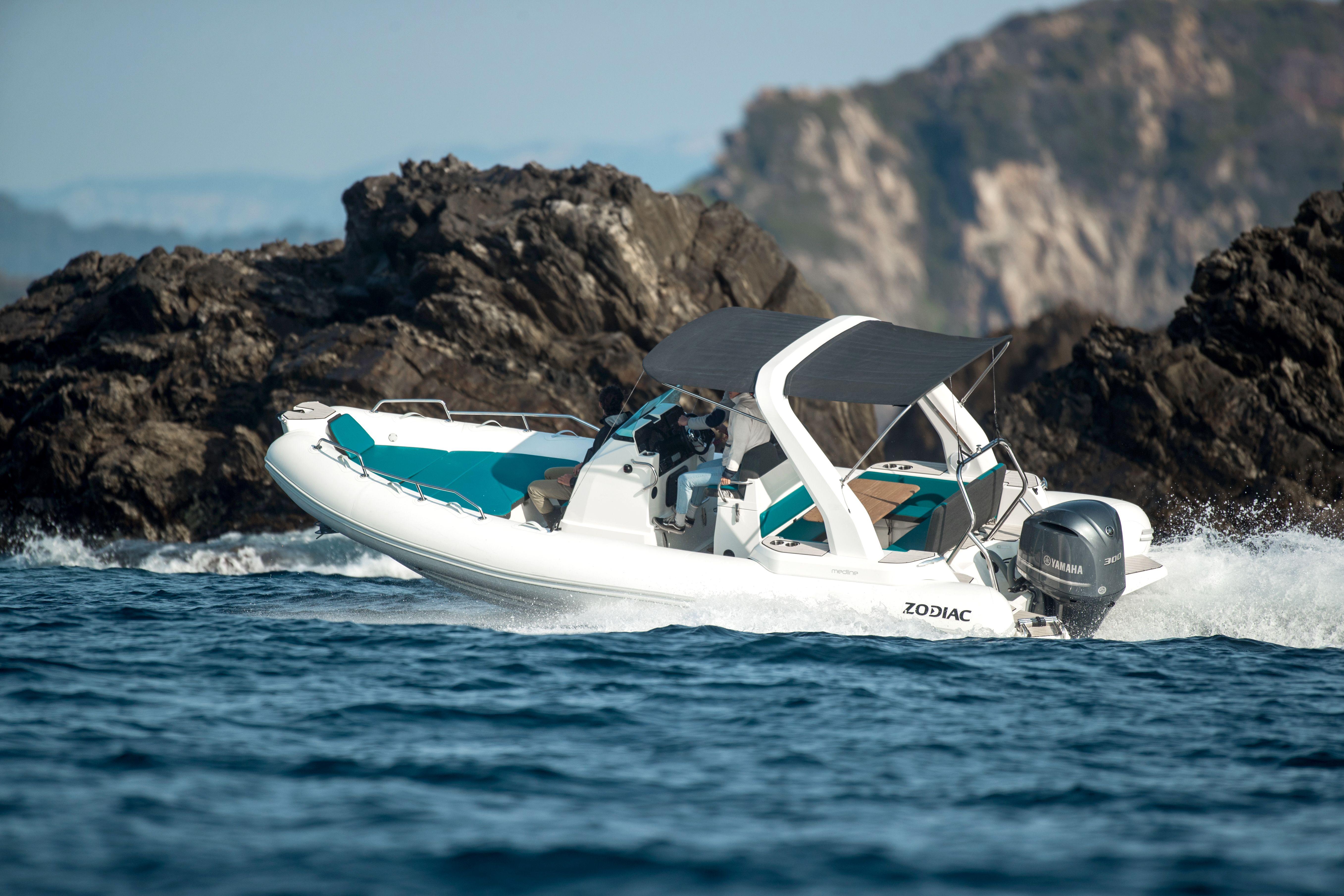 Zodiac Medline 7.5 2019 Zodiac Medline 7.5 boat cruising near rocky coastline.