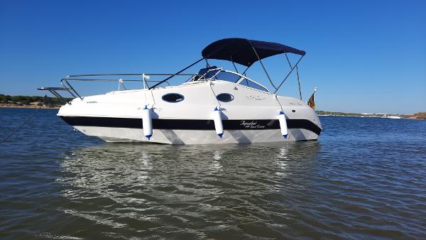 Aquabat Sport Cruiser 20 2021 Aquabat Sport Cruiser 20 boat on calm water under clear blue sky.