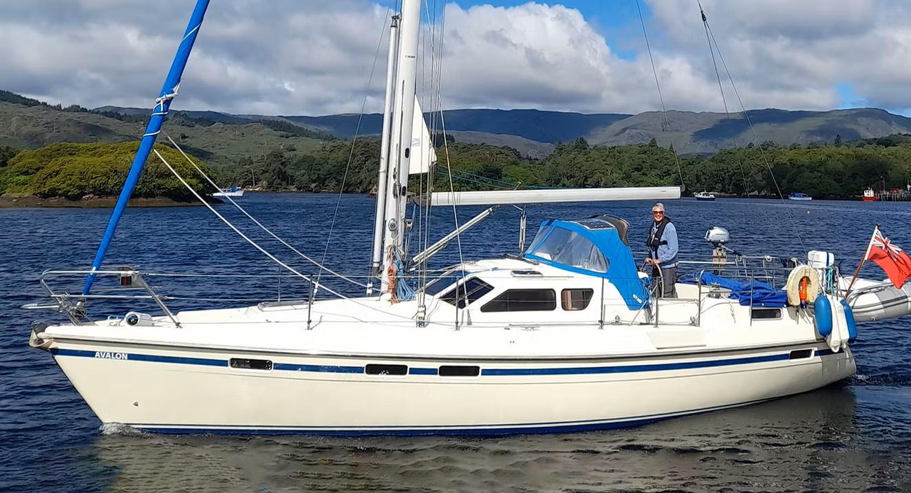 Southerly 115 Series 3 Sailing yacht Southerly 115 Series 3, 1998 model, on a scenic lake with mountains.