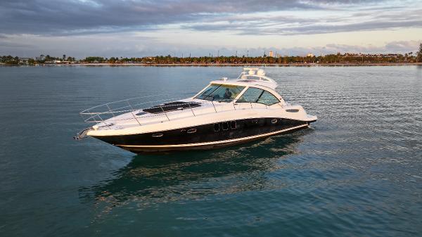 Sea Ray 48 Sundancer 2008 Sea Ray 48 Sundancer yacht cruising on calm waters under a cloudy sky.