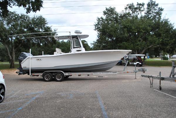 Sea Hunt Gamefish 27 2019 Sea Hunt Gamefish 27 boat on trailer in parking lot.