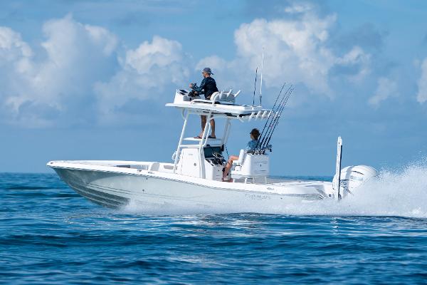 Caymas 28 HB 2024 Caymas 28 HB boat cruising on open water under a clear blue sky.