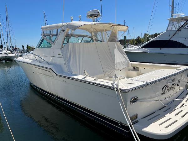 Tiara Yachts 4300 Open 1996 Tiara Yachts 4300 Open docked in a marina under clear blue skies.