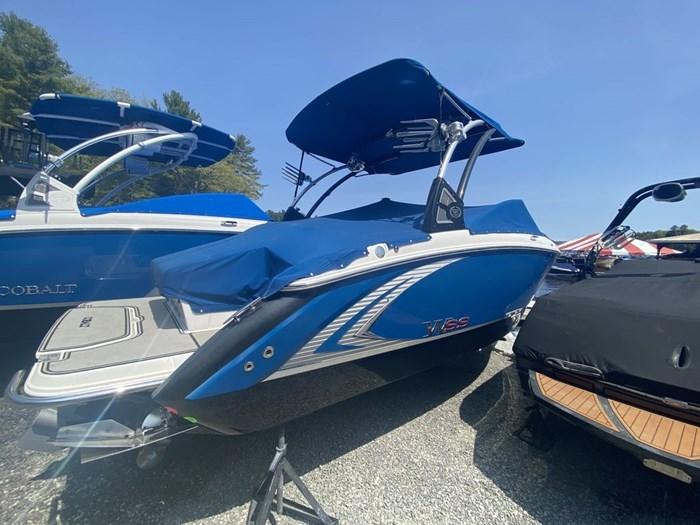 Cobalt R3 WSS 2016 Cobalt R3 WSS boat with blue cover and canopy, parked outdoors.