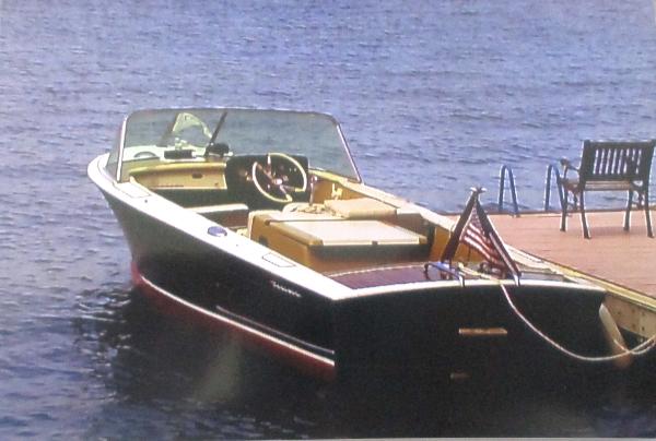 Coronado 21 by Century 1963 Coronado 21 by Century boat docked on a lake.