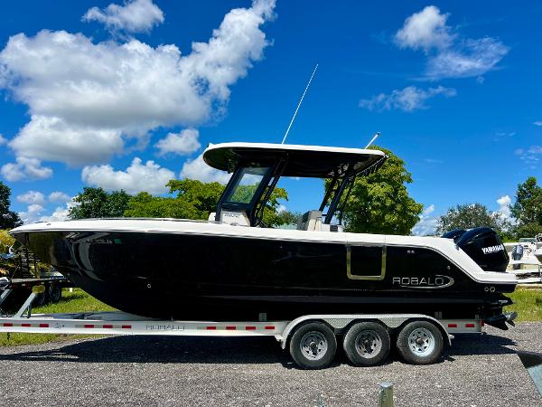 Robalo R272 Center Console 2021 Robalo R272 Center Console boat on trailer under blue sky.
