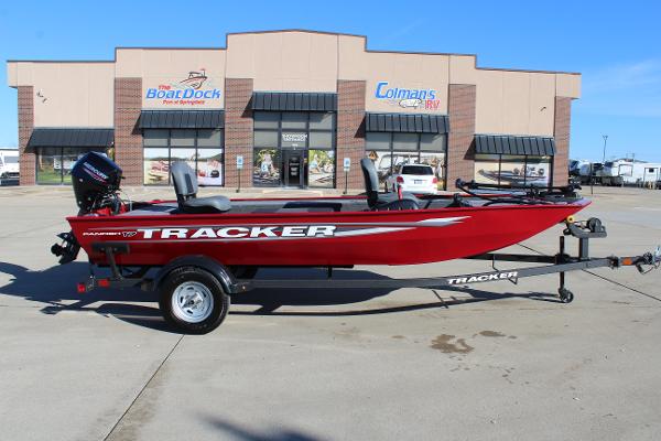 Tracker Panfish 17 2025 Tracker Panfish 17 boat in red, parked outside a dealership.