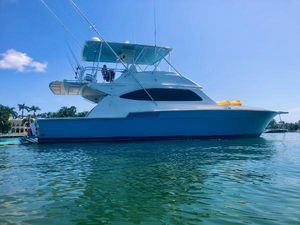 Bertram 54 Convertible 1989 Bertram 54 Convertible yacht on calm water under clear blue sky.