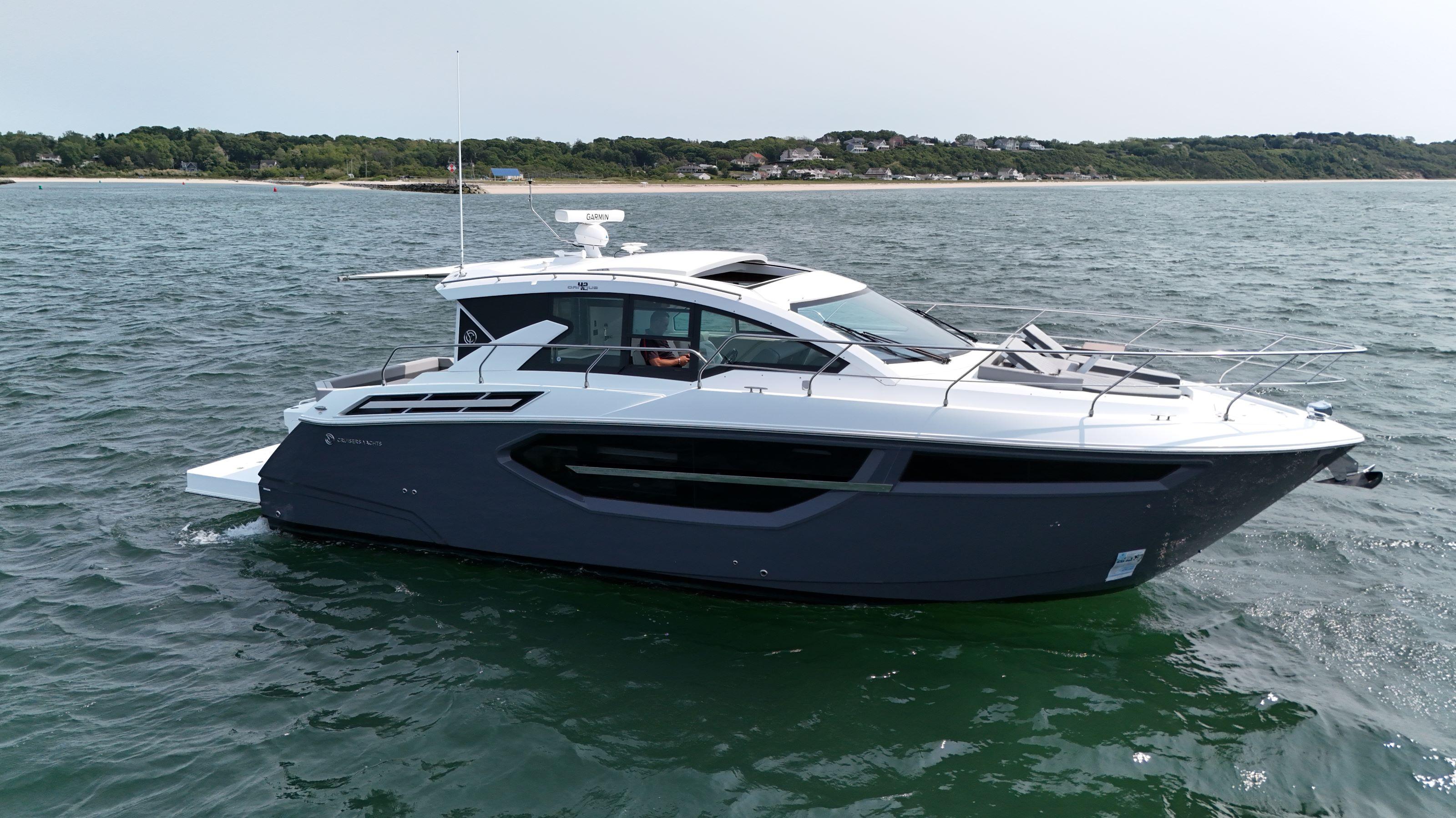 Cruisers Yachts 42 Cantius 2023 Cruisers Yachts 42 Cantius on open water, sleek design, modern luxury yacht.