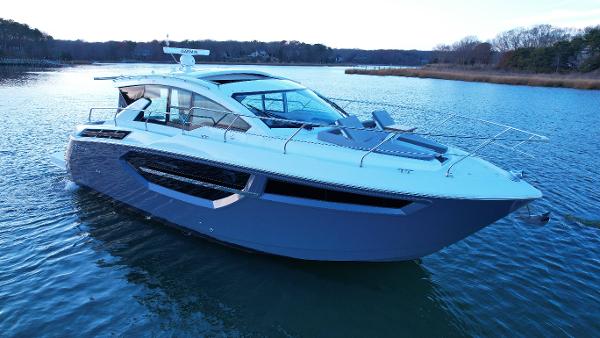 Cruisers Yachts 42 Cantius 2023 Cruisers Yachts 42 Cantius luxury motor yacht on calm water.