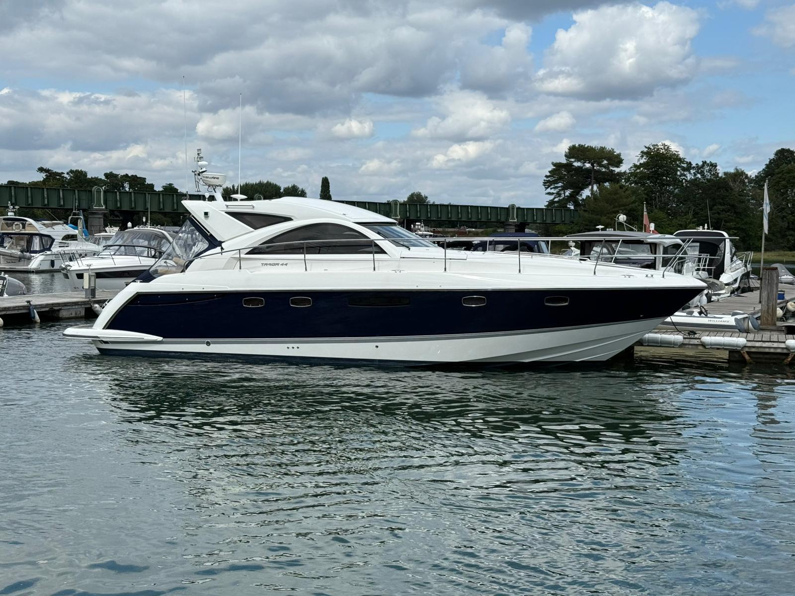 Fairline TARGA 44 GT 2008 Fairline TARGA 44 GT yacht docked in a marina under cloudy skies.