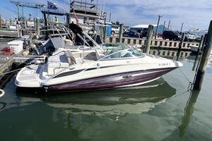 Sea Ray 220 Sundeck 2010 Sea Ray 220 Sundeck boat docked at marina, calm water, clear sky.