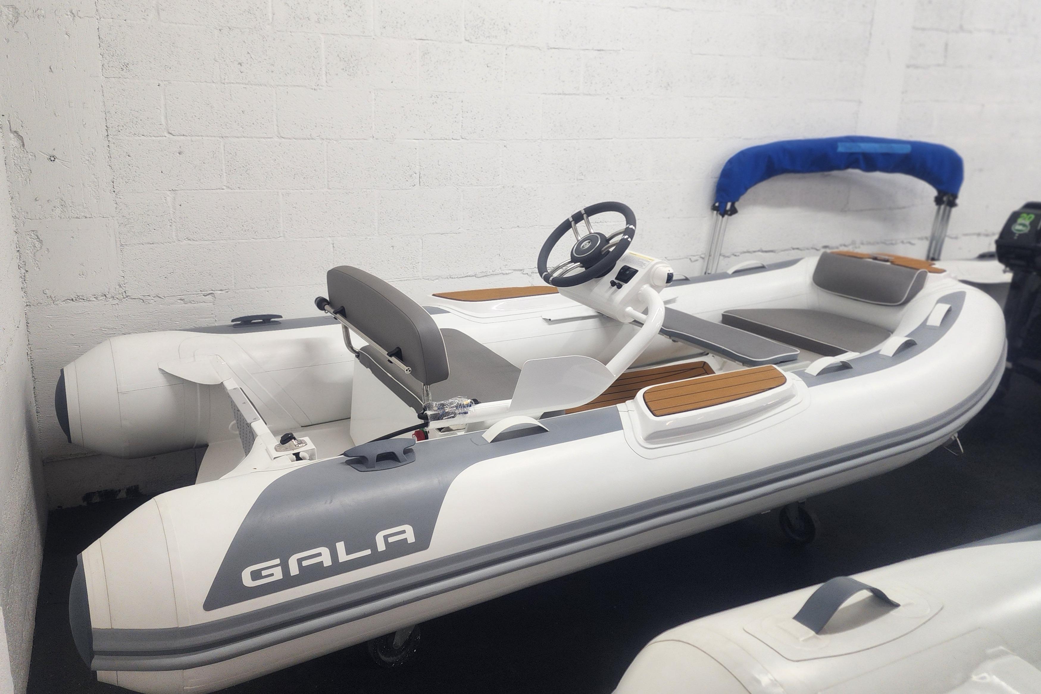 Gala A360Q 2024 Gala A360Q inflatable boat with steering console in a showroom.