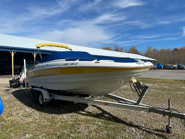 Crownline 240 EX 2007 Crownline 240 EX boat on trailer under blue sky.