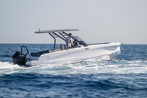 Axopar 22 T-Top 2022 Axopar 22 T-Top boat cruising on open water.