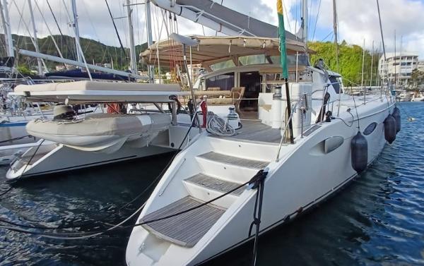 Fountaine Pajot Eleuthera 60 2008 Fountaine Pajot Eleuthera 60 catamaran docked in a marina, featuring spacious deck and modern design.