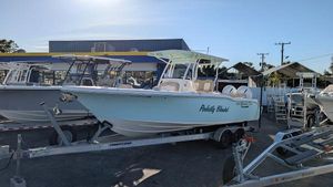 Key West 263 FS 2019 Key West 263 FS boat on trailer, parked outdoors under clear sky.