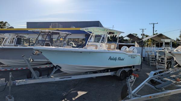 Key West 263 FS 2019 Key West 263 FS boat on trailer, parked outdoors under clear sky.