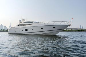Sunseeker Predator 84 Luxury Sunseeker Predator 84 yacht cruising near city skyline, 2006 model.