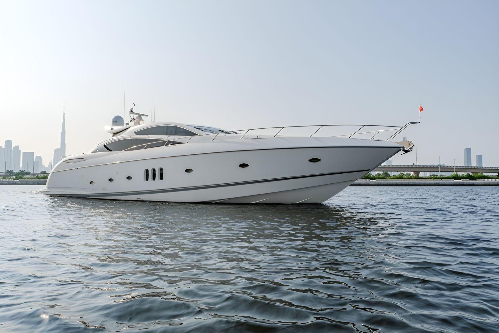 Sunseeker Predator 84 Luxury Sunseeker Predator 84 yacht cruising near city skyline, 2006 model.
