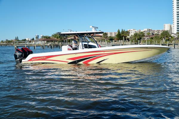 Nor-Tech 392 Superfish 2021 Nor-Tech 392 Superfish boat cruising on water near a marina.