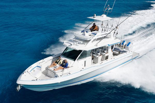 Formula 457 Center Console Fish 2026 Formula 457 Center Console Fish boat cruising on clear blue water.