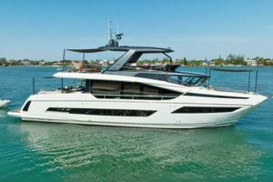 Prestige X70 Luxury 2021 Prestige X70 yacht cruising on clear blue waters.