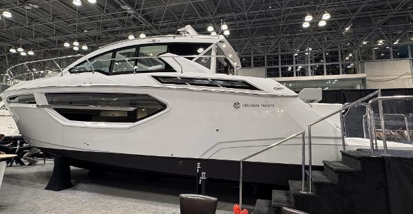 Cruisers Yachts 42 Cantius 2024 Cruisers Yachts 42 Cantius displayed indoors at a boat show.