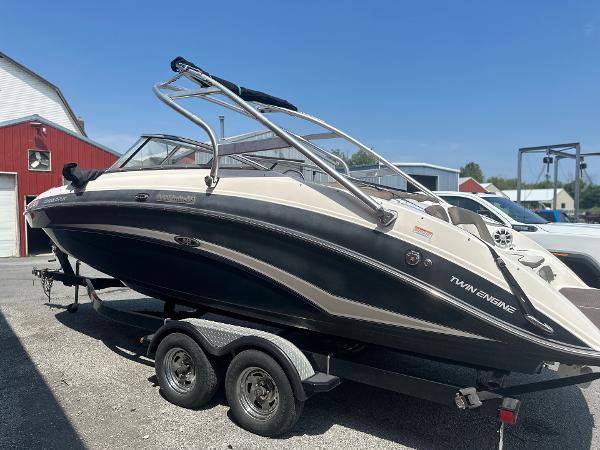 Yamaha Boats 242 Limited S 2012 Yamaha Boats 242 Limited S on trailer, black and white, twin engine, parked outdoors.