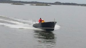 Cooper 800 A Cooper 800 boat from 2015 speeding on a calm lake.
