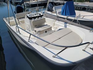 Boston Whaler 170 Montauk, 115 HP Warranty into 2028 2023 Boston Whaler 170 Montauk boat docked, showcasing spacious seating and sleek design.