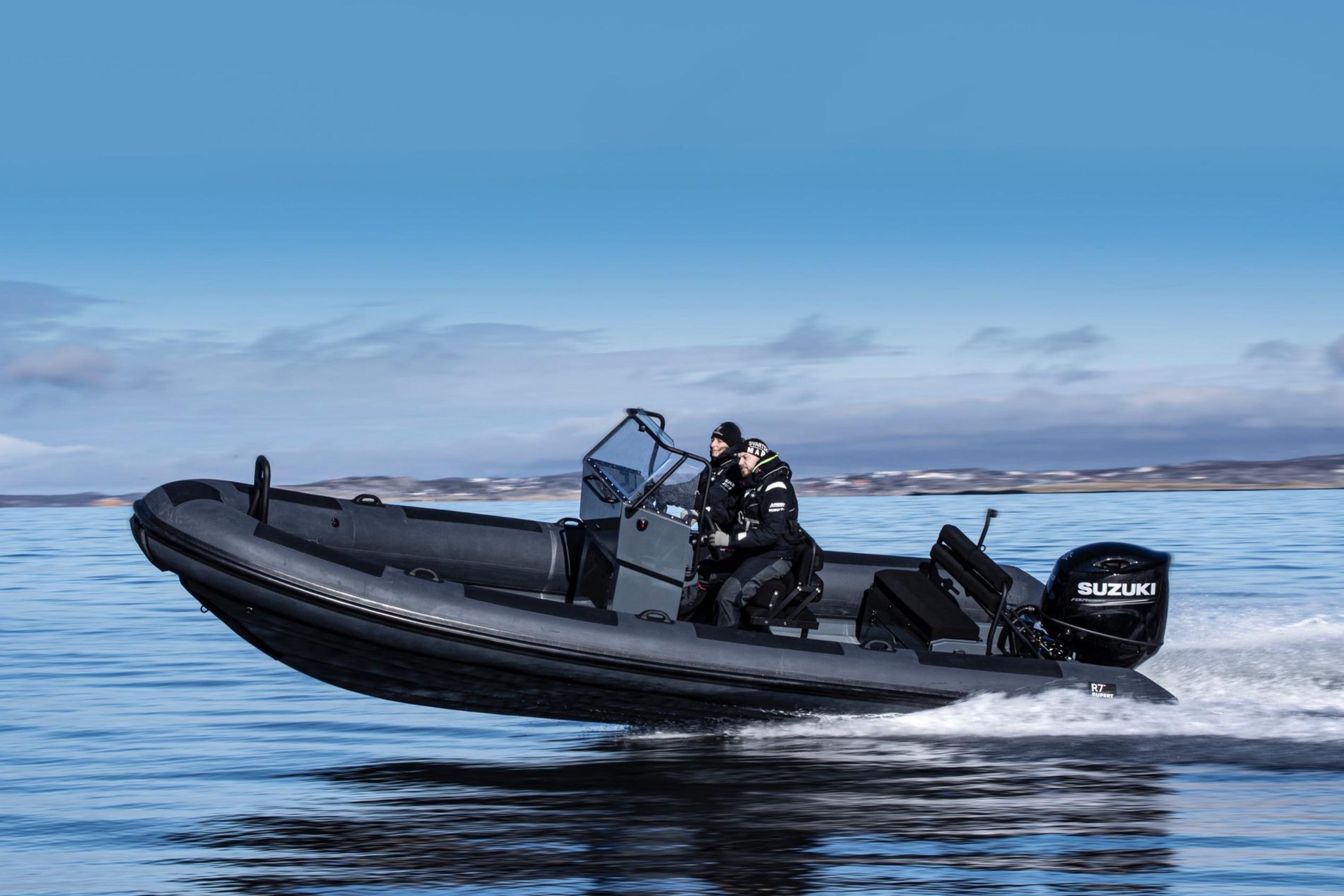 Rupert R7 Jocky 2026 Rupert R7 Jocky boat speeding on water with Suzuki engine, under clear blue sky.