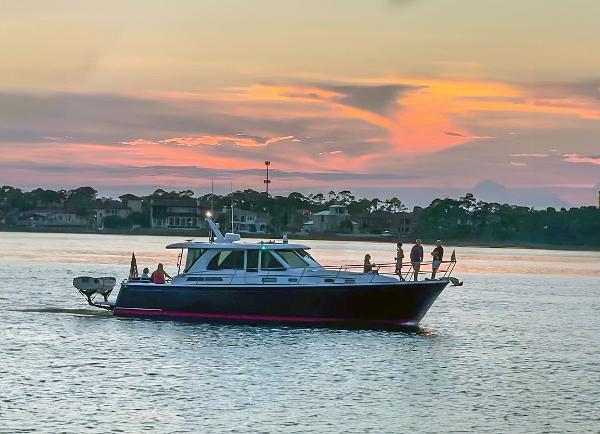 Sabre 45 Salon Express 2017 Sabre 45 Salon Express yacht cruising at sunset on calm waters.